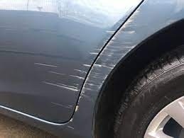 A car with visible scratches on the front bumper, representing car body repairs in Flackwell Heath.